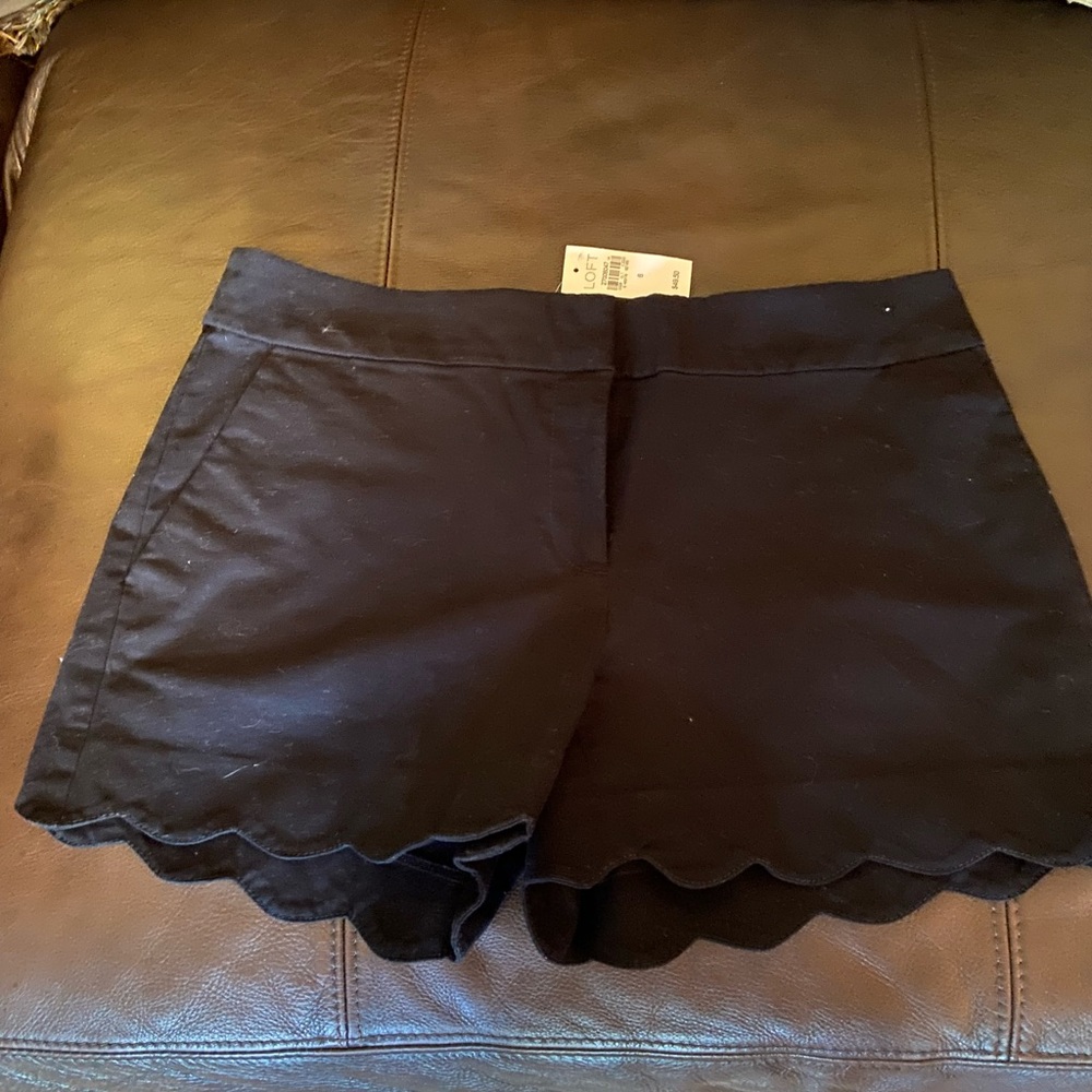 Brand new. Scallop bottom rim.